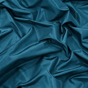 Tissu Tito Taffetas 1901, taffetas de 300 cm aux reflets subtils, coloris bleu pétrole